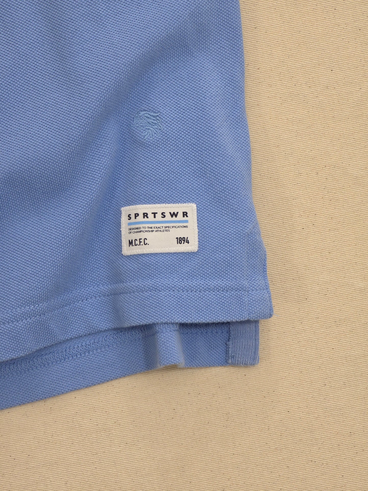 Nike Manchester City FC niebieska koszulka polo haft monogram retro rozm. S